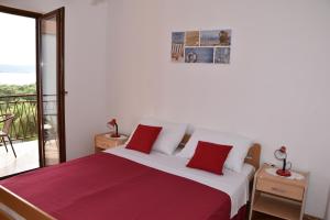 Postel nebo postele na pokoji v ubytování Apartmani Bošana