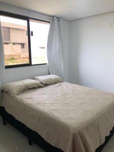 a bed in a room with a window at Villas de Bananeiras in Bananeiras +29 photos
