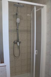 a shower with a shower head in a bathroom at Villa Kiki in Rovinj +69 photos
