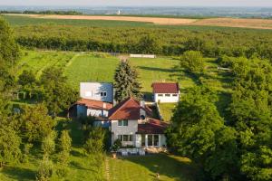 an aerial view of a house in a field at Danubio Residence in Aljmaš