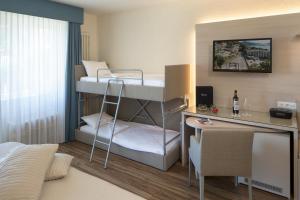 Voodi või voodid majutusasutuse Hotel Campione toas