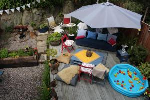 an overhead view of a patio with an umbrella at Tulloch (2 Hamilton Place) in Kyle of Lochalsh