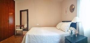 Postel nebo postele na pokoji v ubytování Apartamento Rías Baixas - 1a Línea Playa Raxó