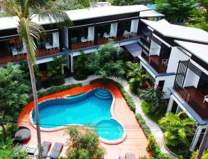 an aerial view of a house with a swimming pool at The Ozo Kohtao in Koh Tao