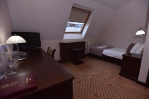 Postel nebo postele na pokoji v ubytování Hotel Beograd