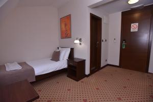 Postel nebo postele na pokoji v ubytování Hotel Beograd