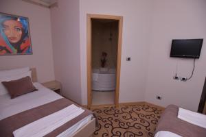 Postel nebo postele na pokoji v ubytování Hotel Beograd