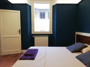 Posteľ alebo postele v izbe v ubytovaní BORGO SAN FREDIANO SUITES
