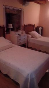 En eller flere senger på et rom på Casa Rural Anxeliña
