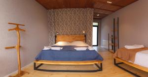A bed or beds in a room at Vache Hotel