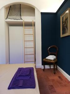 Posteľ alebo postele v izbe v ubytovaní BORGO SAN FREDIANO SUITES