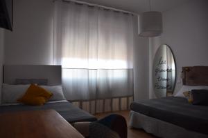 A bed or beds in a room at Levante