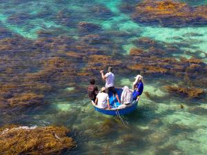 a group of people in a boat in the water at Phu Loc Motel in Quang Ngai