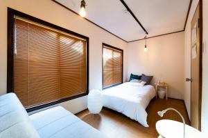 เตียงในห้องที่ Satellite Hotel Yoyogi Sangubashi サテライトホテル代々木参宮橋