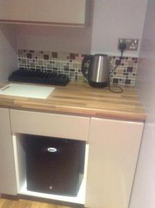 Kuchyň nebo kuchyňský kout v ubytování The Anfield Apartment