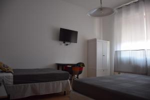 A bed or beds in a room at Levante