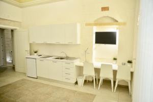 A kitchen or kitchenette at NMCpalace