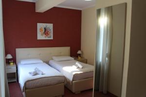 Postel nebo postele na pokoji v ubytování Signature Idea hotel