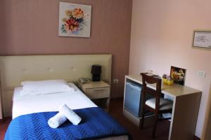 Postel nebo postele na pokoji v ubytování Signature Idea hotel