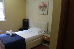 Postel nebo postele na pokoji v ubytování Signature Idea hotel