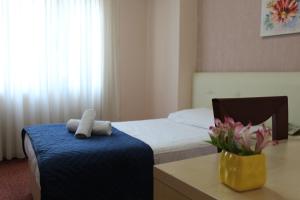 Postel nebo postele na pokoji v ubytování Signature Idea hotel