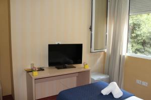 TV a/nebo společenská místnost v ubytování Signature Idea hotel