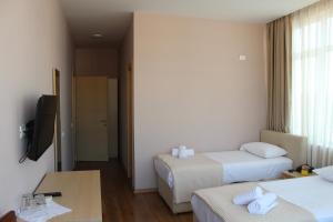 Postel nebo postele na pokoji v ubytování Signature Idea hotel