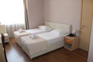 Postel nebo postele na pokoji v ubytování Signature Idea hotel