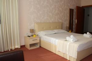 Postel nebo postele na pokoji v ubytování Signature Idea hotel