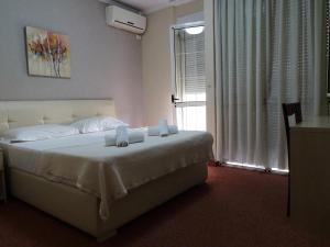 Postel nebo postele na pokoji v ubytování Signature Idea hotel