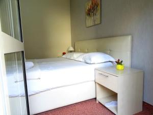 Postel nebo postele na pokoji v ubytování Signature Idea hotel