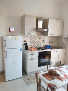 Kuchyň nebo kuchyňský kout v ubytování B&B Figura Apartments
