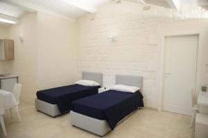 A bed or beds in a room at NMCpalace