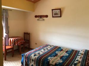 Voodi või voodid majutusasutuse Hostal Curiñan toas