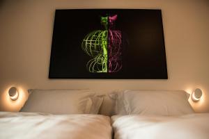 Postel nebo postele na pokoji v ubytování WUD hotel