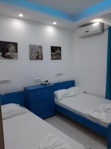 Posteľ alebo postele v izbe v ubytovaní B&A Paralia