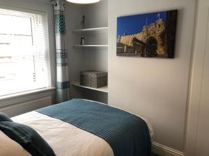 Postel nebo postele na pokoji v ubytování Archie's Cottage