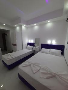 Posteľ alebo postele v izbe v ubytovaní B&A Paralia