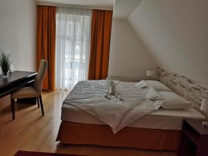 Posteľ alebo postele v izbe v ubytovaní GRASSEGGER APPARTEMENTHAUS