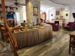 a table with food on it in a living room at Rain Hotel in Kizkalesi