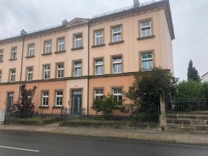 a large building on the side of a street at Luna Estela in Bayreuth
