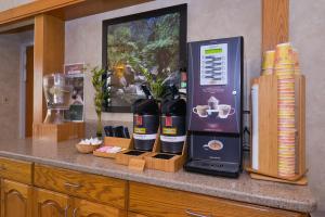 a display of wine bottles on a counter at Greenstay Hotel & Suites Central in Springfield