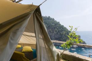 a tent with a view of the ocean at Bella Baia Campsite in Maiori