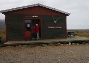 two people standing in the door of a small building at Stafafell Ready Tents in Stafafell