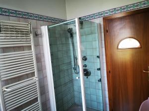 a bathroom with a shower with a glass door at Cà ARIVANLIAL Venice villa apartament in Venice-Lido