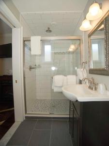 a bathroom with a shower and a sink at Bellevue Manor in Newport