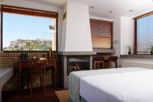 Posteľ alebo postele v izbe v ubytovaní Acropolis Eye Loft
