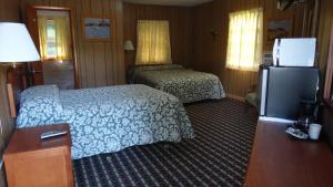 Postel nebo postele na pokoji v ubytování Pine Ridge Motel