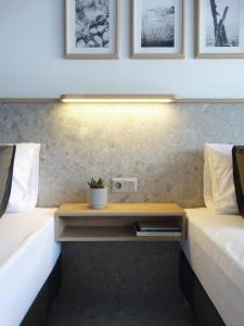 Postel nebo postele na pokoji v ubytování Voula Seaside Apartments