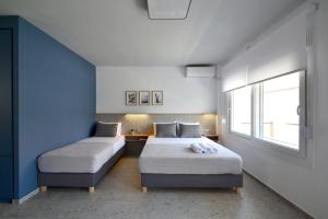 Postel nebo postele na pokoji v ubytování Voula Seaside Apartments